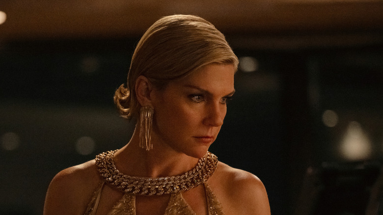 Rhea Seehorn's Carol Sturka wearing a fancy dress and jewelry on Pluribus