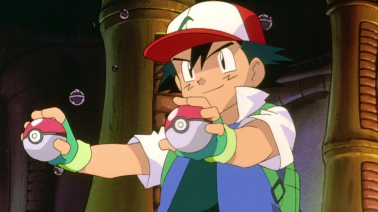 Ash, holding two Pokeballs in a large, black arena, a scene from Pokemon: The First Movie.