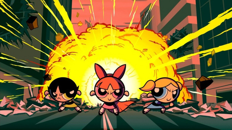 The Powerpuff Girls standing in front of an explosion in The Powerpuff Girls