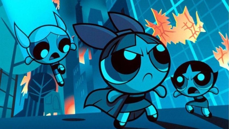 Bubbles, Blossom, and Bubblegum heading into battle in the city at night in The Powerpuff Girls