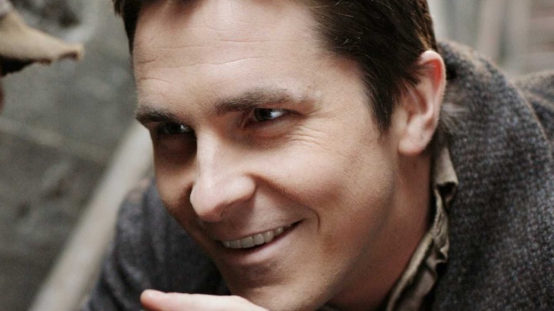 Christian Bale in The Prestige smiles in close-up