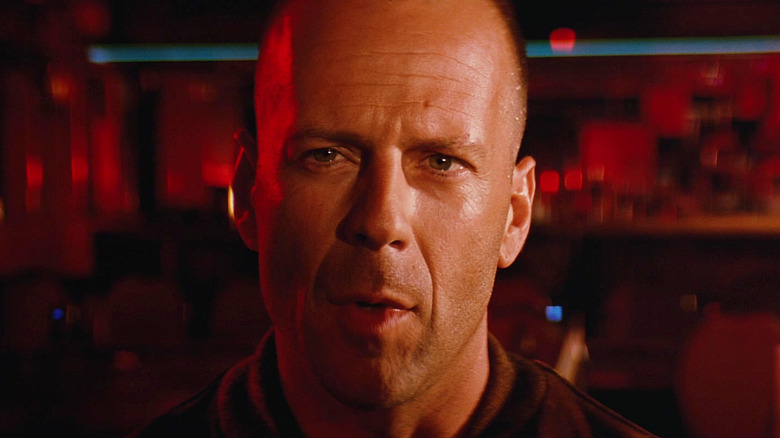 Butch listens to Marcellus Wallace talk in Pulp Fiction