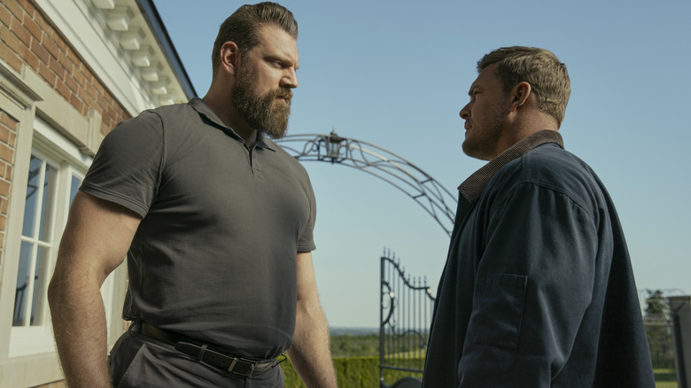 Olivier Richters as Paulie and Alan Ritchson as Reacher stare at each other in season 3 of Reacher