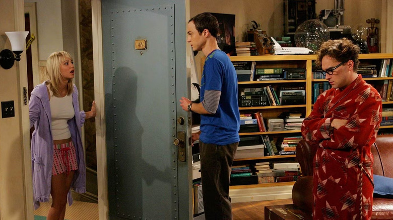 Penny yelling at Sheldon and Leonard in their doorway on The Big Bang Theory