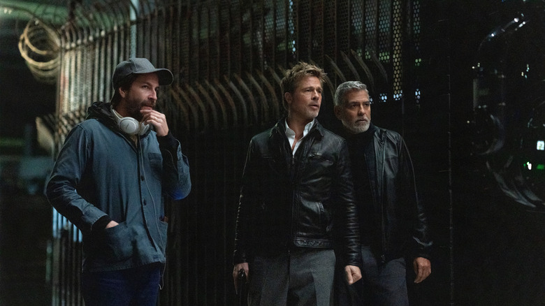 Brad Pitt, George Clooney, and Jon Watts on the Wolfs set