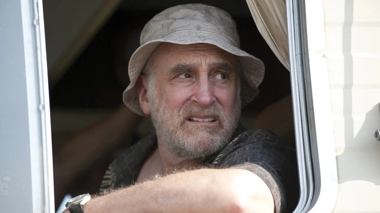 Dale grimacing in his RV on The Walking Dead