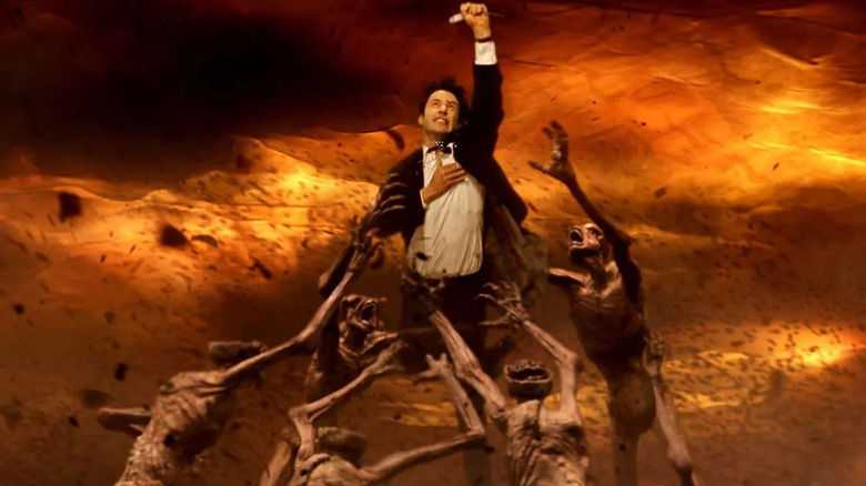 John Constantine holds some air while demons tried to pull it to hell. From Constantine.
