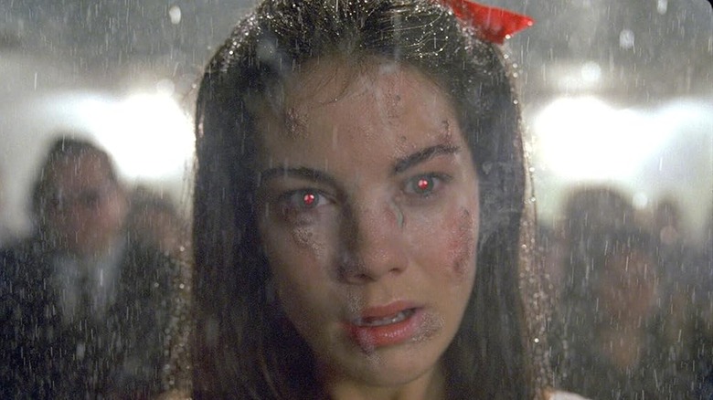 Michelle Monaghan as Ellie being soaked in the rain in Constantine