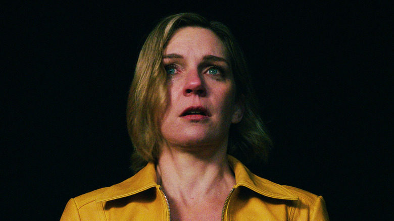 Rhea Seehorn's Carol Sturka looks upset in closeup in Pluribus