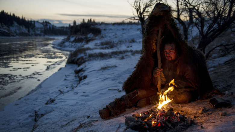 Hugh Glass in a tent by a river in The Revenant.