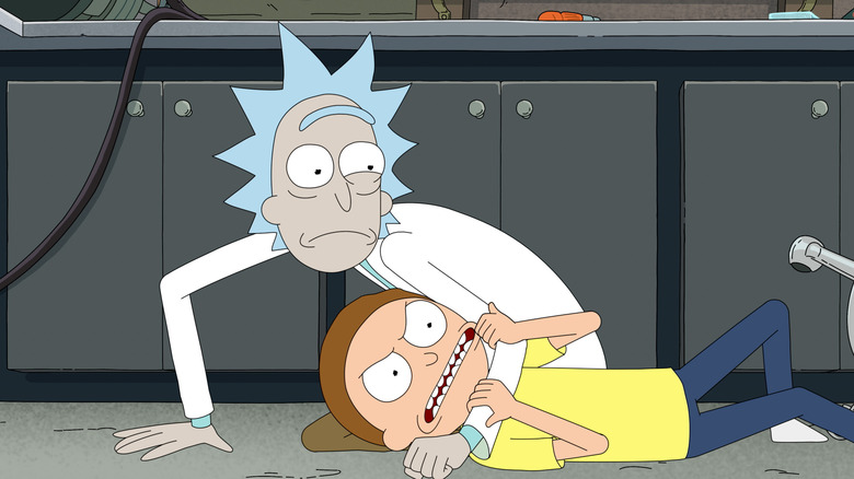 Rick holding Morty down while the boy screams in anger in Rick and Morty