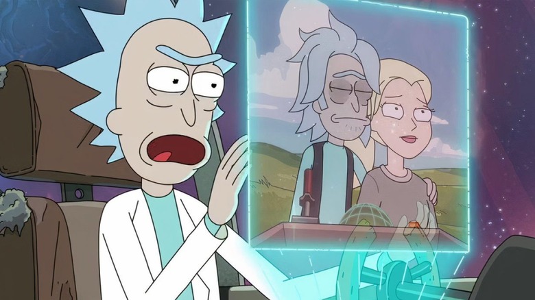 Rick staes in anger at a memory version of himself and Diane on a screen in Rick and Morty