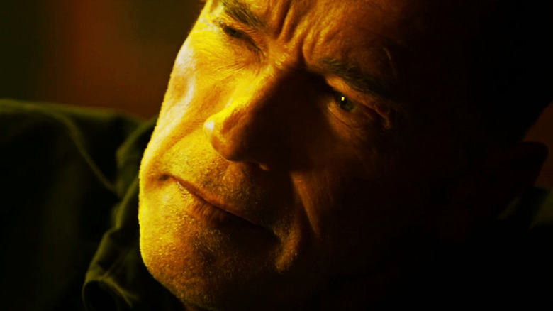 Arnold Schwarzenegger's John Wharton is seen in closeup as he looks to his right in Sabotage