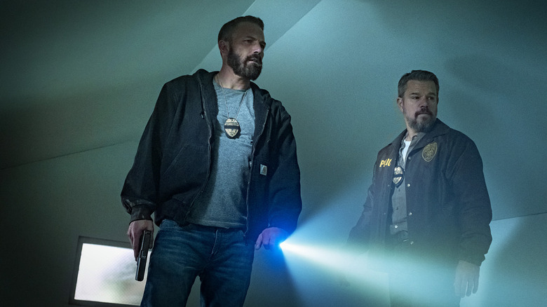 JD and Dane spot something in a dark house in The Rip