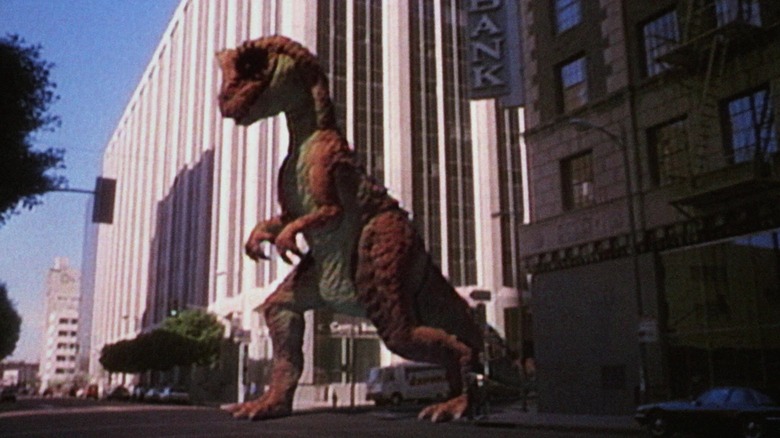 A dinosaur walking down the street in a fake TV commercial in RoboCop
