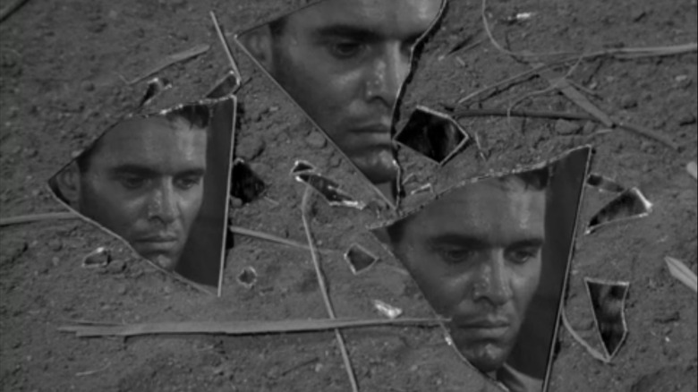 A sad man's face reflected in three shards of a broken mirror in an episode of The Twilight Zone.
