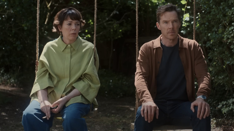 Olivia Colman and Benedict Cumberbatch as Ivy and Theo sitting on swings in their yard in The Roses