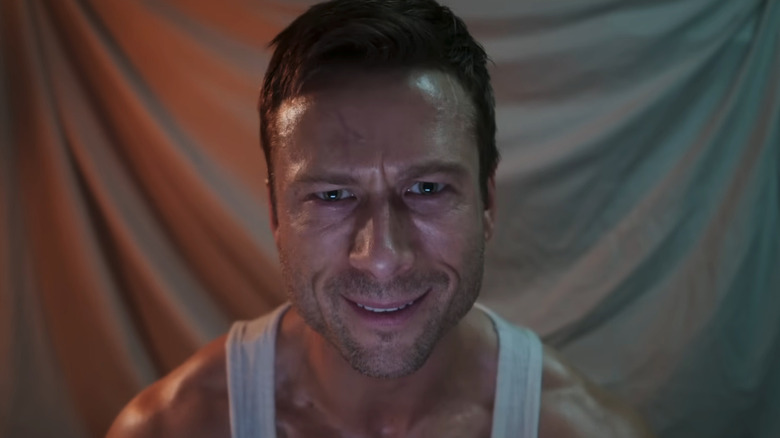 Glen Powell as Ben Richards recording a video diary in The Running Man