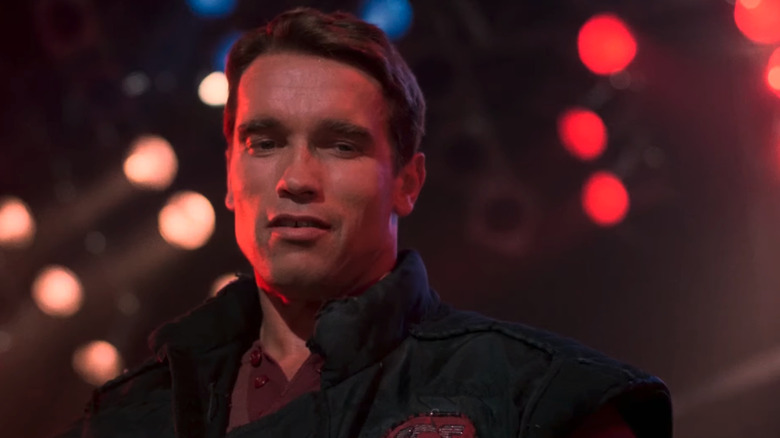 Ben Richards (Arnold Schwarzenegger) looks down at Killian as he prepares to end his life in 1987's The Running Man