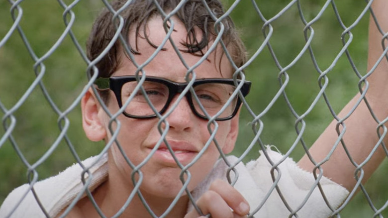 Squints (Chauncey Leopardi) looks at Wendy through the pool fence in The Sandlot