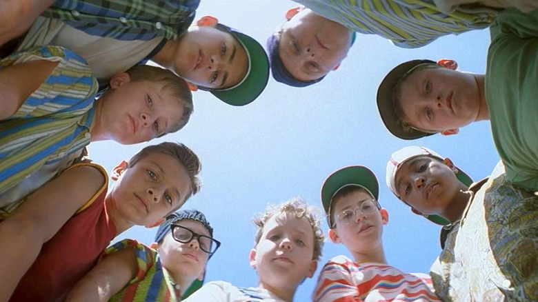 The Sandlot kids standing in circle