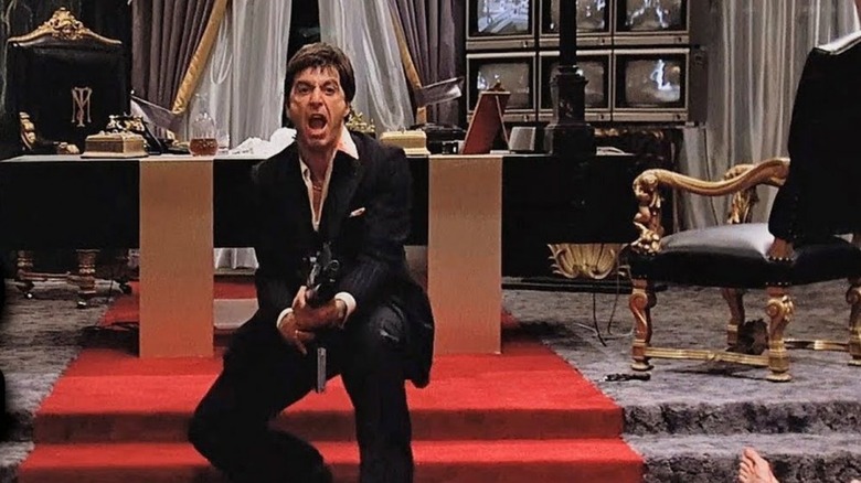Tony Montana brandishing a machine gun