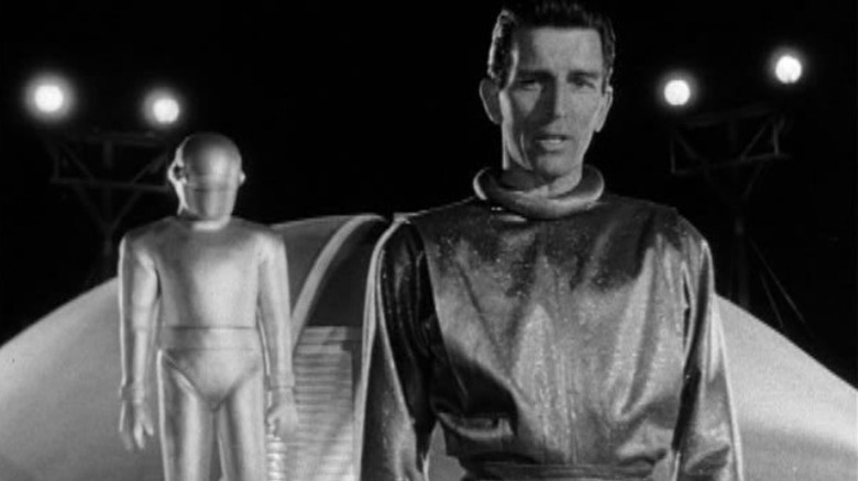 Klaatu stands ahead of Gort