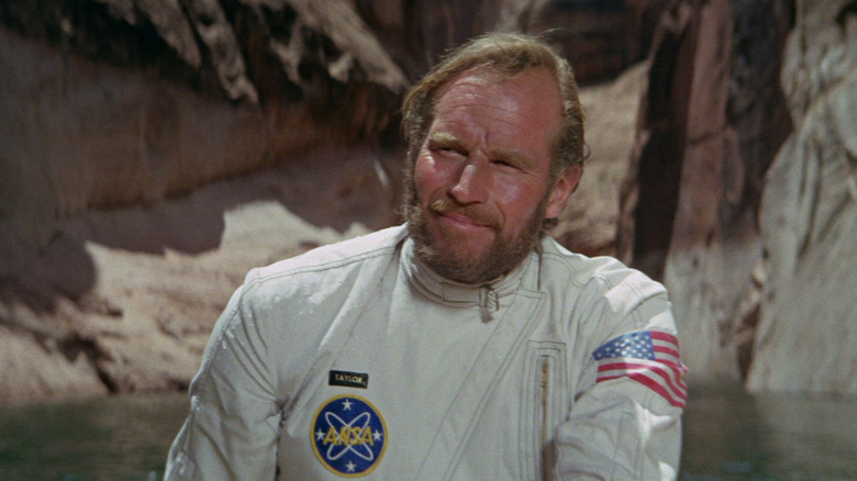 Charlton Heston as George Taylor wearing a spacesuit in Planet of the Apes (1968)