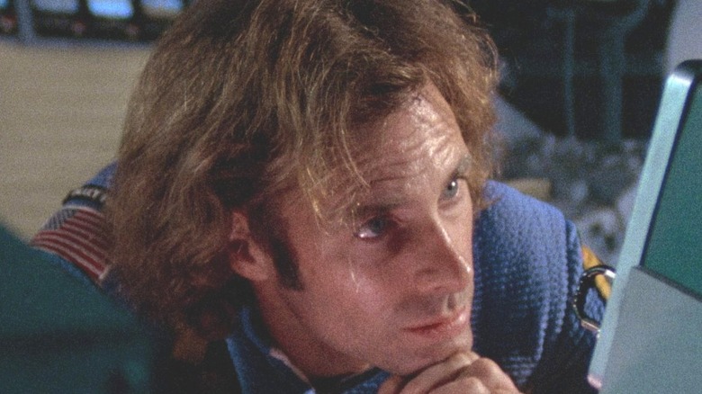 Freeman Lowell looking closely at a computer monitor in Silent Running