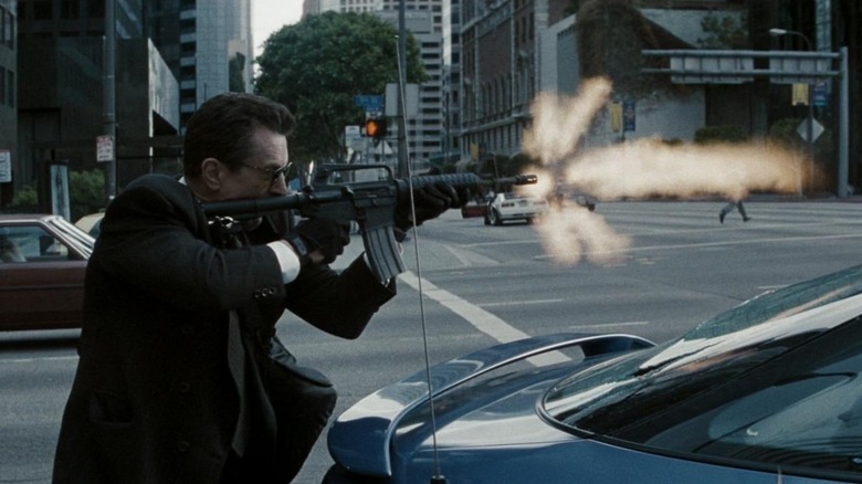 Heat de niro firing gun on street