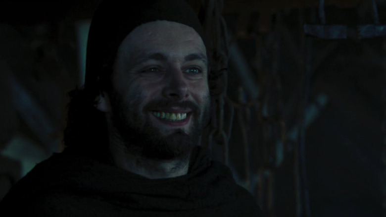 Michael Sheen as Bailan's half-brother and the village priest