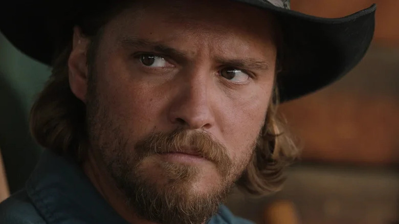 Luke Grimes' Kayce Dutton looks off to his right in closeup in Yellowstone