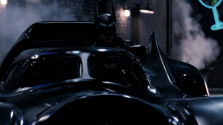 Michael Keaton's Batman emerges from the Batmobile in Batman Returns