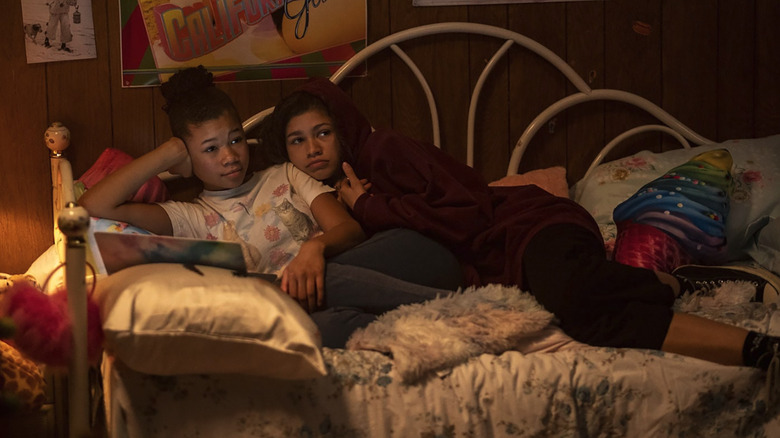 Gia and Rue curled on the bed in Euphoria
