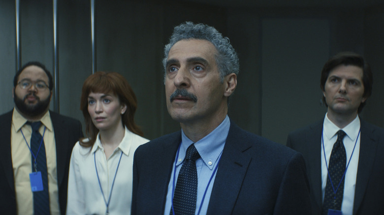 Irving standing in front of the MDR team in Severance