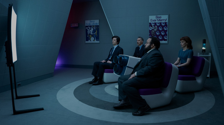 Mark, Irving, Helena and Dylan watch the video on the cut floor in the cut