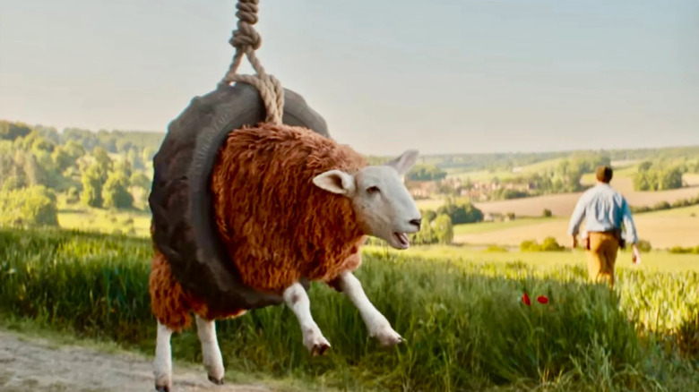 A sheep enjoys his tire swing while George hikes off in The Sheep Detectives