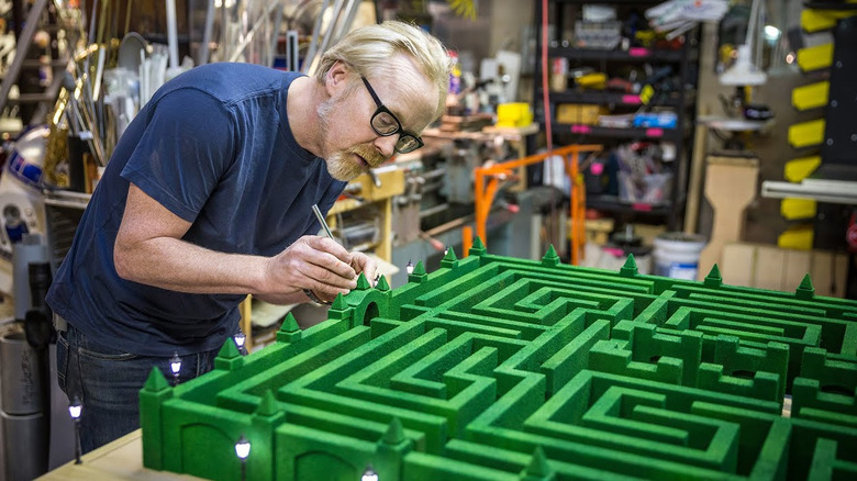 Adam Savage works on a maker project on his YouTube series Tested