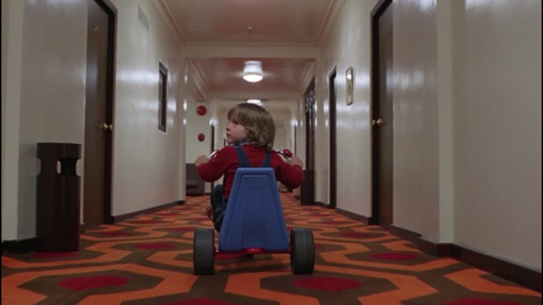 Danny Lloyd in The Shining hallways