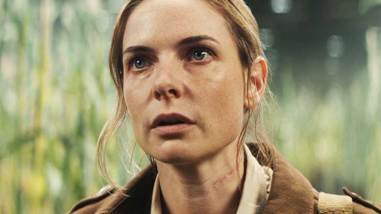 Rebecca Ferguson's Juliette Nichols is seen in closeup as she stands in a field in Silo