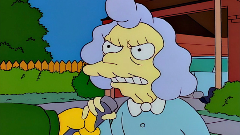 Alice Glick yelling into microphone on The Simpsons