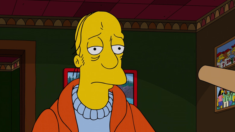 Larry sitting at Moe's bar on The Simpsons