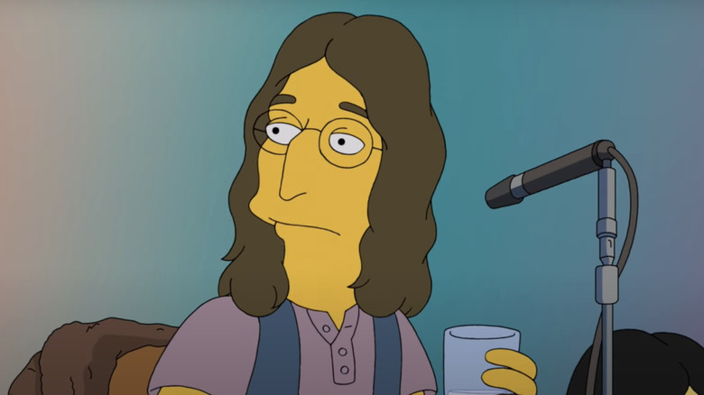 John Lennon holds a glass of water while sitting in front of a microphone in The Simpsons.