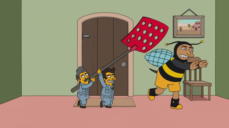 Bumblebee Man being chased by two actors with a giant fly swatter in The Simpsons