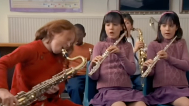 The Simpsons live-action title sequence - Lisa playing saxophone next to Sherri and Terri in music class