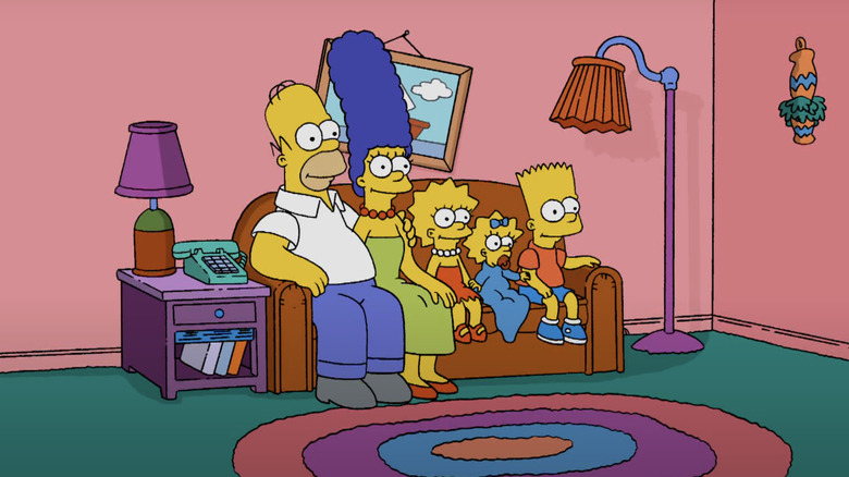 The Simpson family sits on the couch in The Simpsons