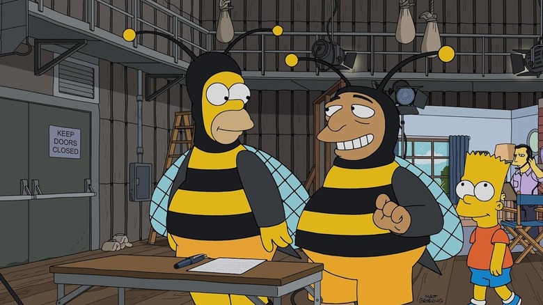 Homer and Bumblebee Man with Bart on a studio set in The Simpsons