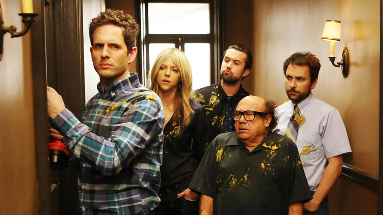 Glenn Howerton as Dennis, Kaitlin Olson as Dee, Rob McElhenney as Mac, Danny DeVito as Frank, and Charlie Day as Charlie on It's Always Sunny in Philadelphia