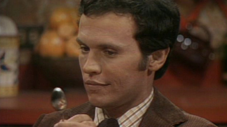 Jodie looking at a spoon on Soap