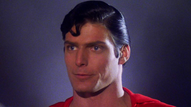 Christopher Reeve's Superman is seen in closeup against a black background in Superman